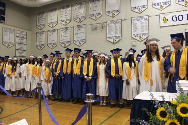 Students stand during the PMHS Graduation ceremony on June 23. 