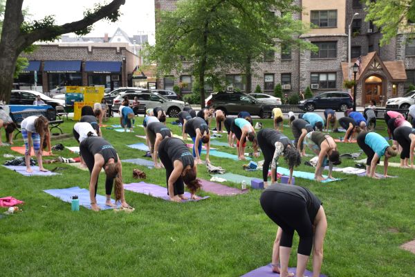 Dozens enjoyed free yoga at Summer Solstice event at Gazebo.