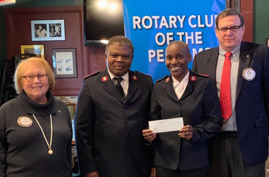 Rotary President Lyn Roth Jacobs, Daniel and Charlotte Diakanwa of the Salvation Army in New Rochelle and Rotarian Bob Rendon.