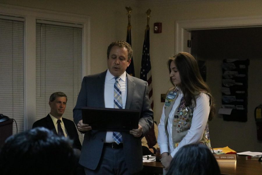 Right, Gold Award Girl Scout Kimberly Rosell receives her commendation from Pelham Mayor Chance Mullen.