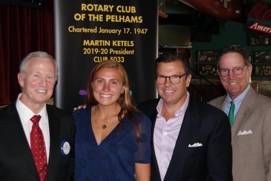 From left, Rotarian Ellis Moore Jr., Charlotte Edmunds; her father, Robert Edmunds, and Rotarian Kevin Falvey.