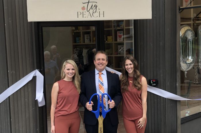 Pelham Mayor Chance Mullen joined Tig and Peach owners Amanda Tigges Star and Emily Donnelly in ribbon cutting.