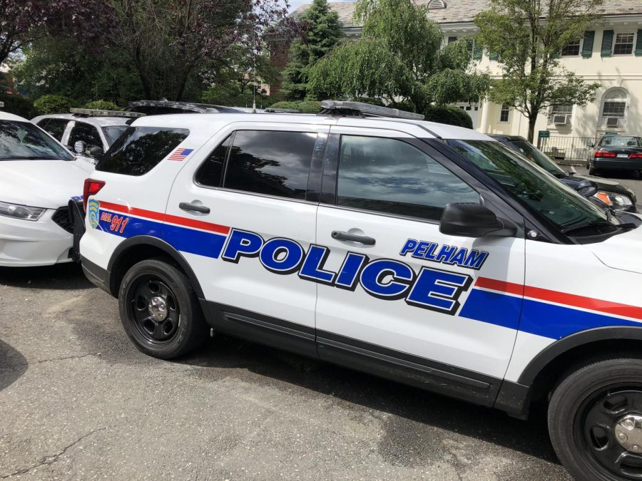 Village of Pelham police vehicles parked next to Town Hall, which houses the department.