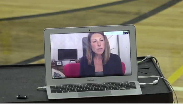 School board president Jessica DeDomenico on a laptop screen during a Zoom school board meeting.