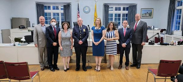 New Pelham Manor Police Chief Thomas Atkins (center) with village board members and administrators.