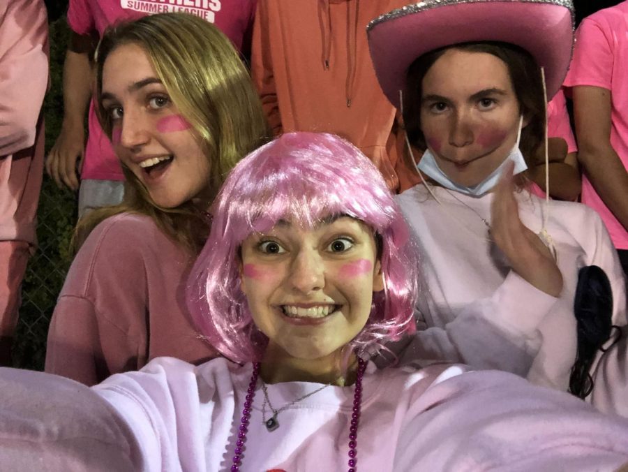 From left, Katie Brandler, Anna Gambone and Lily Maguire pinked out when PMHS football traveled to Rye.
