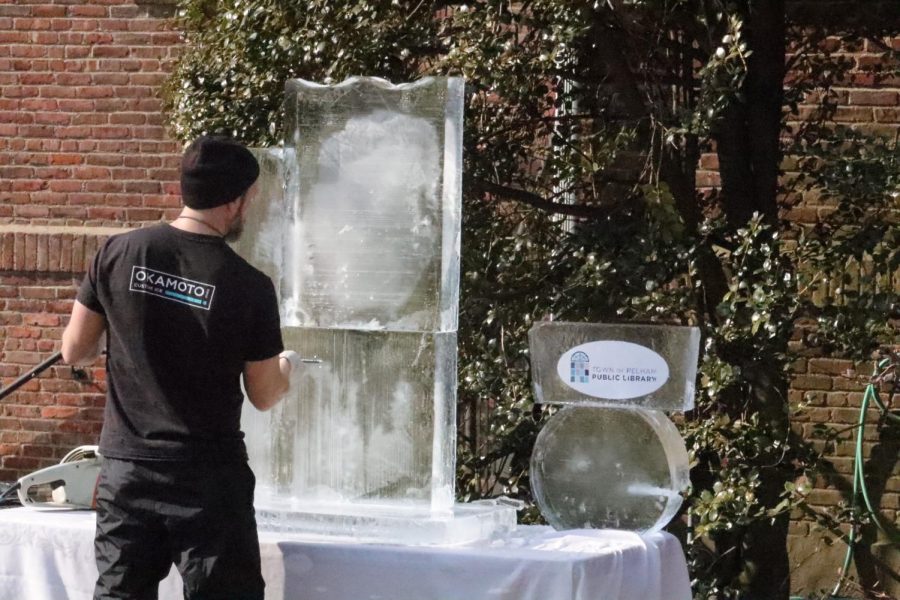 Sculpture of pelican emerges from block of ice in honor of PMHS centennial