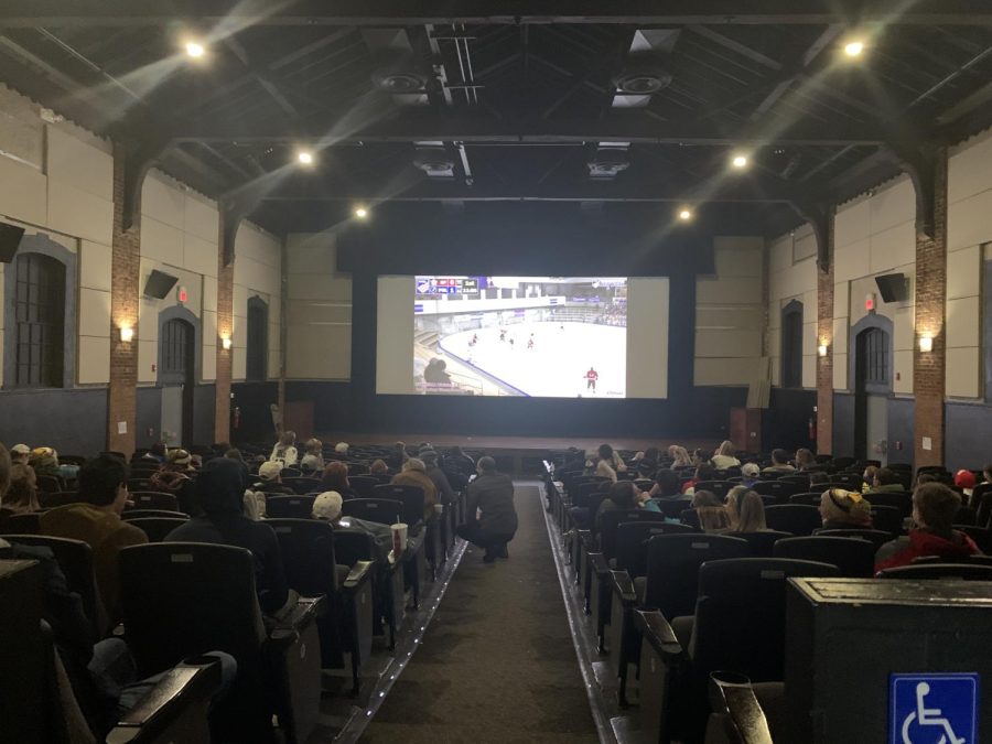 Supporters cheer on the PMHS ice hockey team inside The Pelham Picture House.
