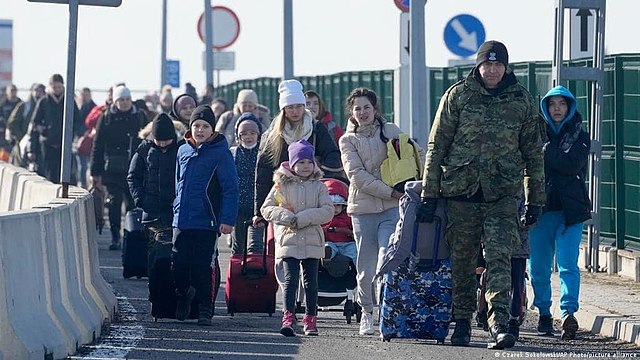 Ukrainian refugees crossing into Poland.