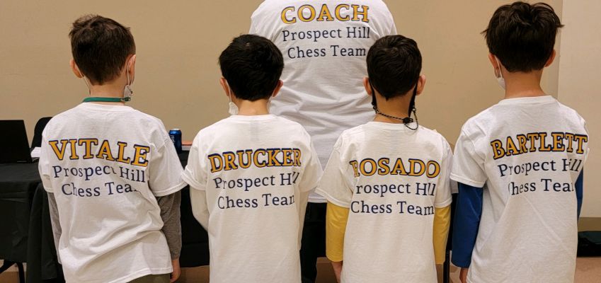 Prospect Hill team and third grader Ari Drucker collect trophies at state chess tournament