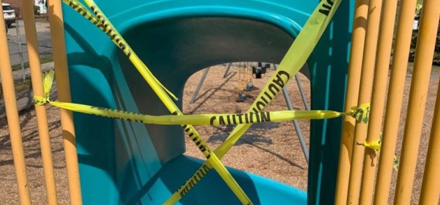 Caution tape on playground equipment in Juliannes Park in mid-March.