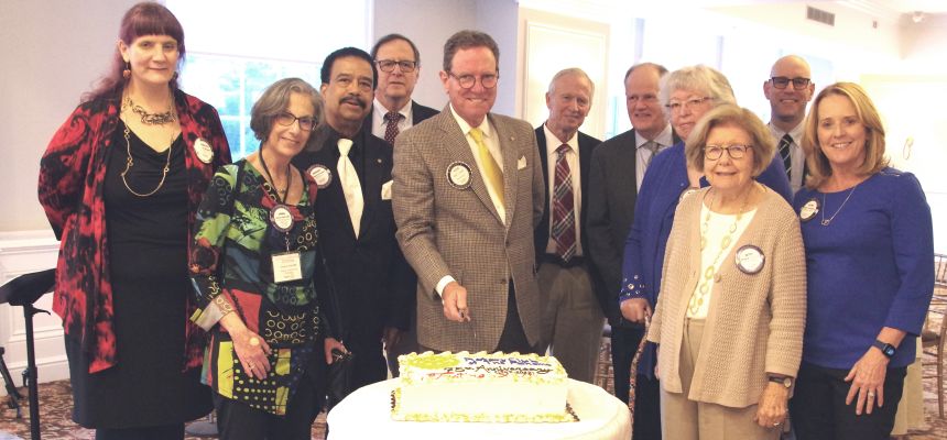 Rotary+Club+of+the+Pelhams+President+Kevin+Falvey+%28center%29+holds+knife+to+cut+cake+celebrating+the+club%E2%80%99s+75th+anniversary+with+some+members+of+the+club+who+were+present+at+Tastings+XVI.