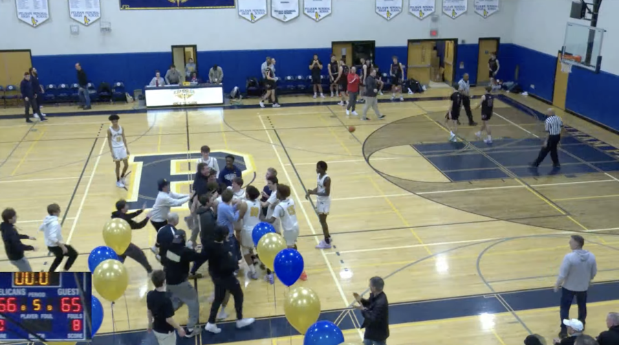 PMHS+student+section+celebrates+on+court+with+the+team.