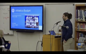 Athletic Director Joe Toombs III presents to the school board.