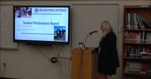 Clair Comerford, assistant superintendent for teaching and learning, reports to the school board on student performance.