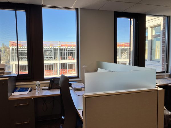 From a window in the new Municipal Center, the Pelham House apartment building can be seen under construction across Fifth Avenue.