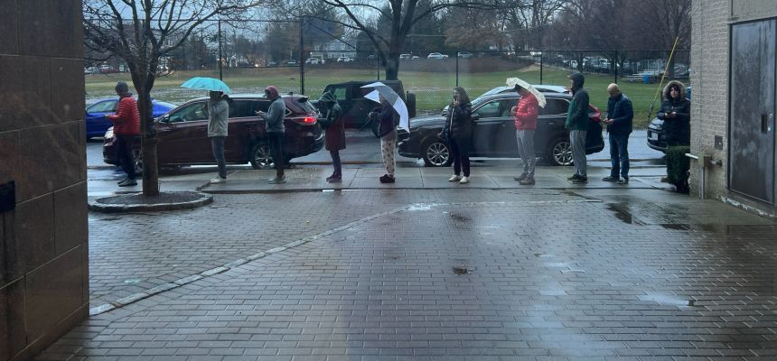 Parents wait to pick up students after Pelham Middle School closes.