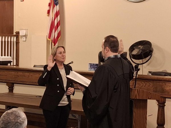 Theresa Mohan being sworn in as Town Supervisor of Pelham by Town Justice Adam Kagan