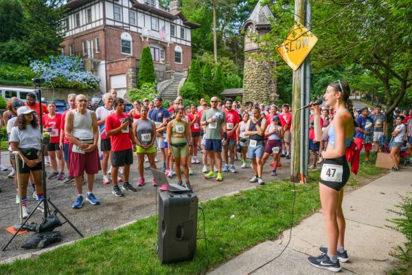 Grace Kiamie sings the national anthem before the race.